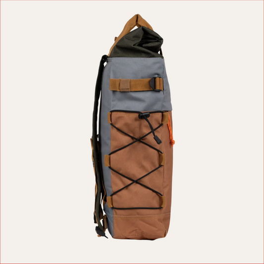 Flat lay side view of Two-tone rolltop backpack with tan base, grey upper, black top flap and orange drawcord — modern utility bag for men by Shoreditch & Hale.
