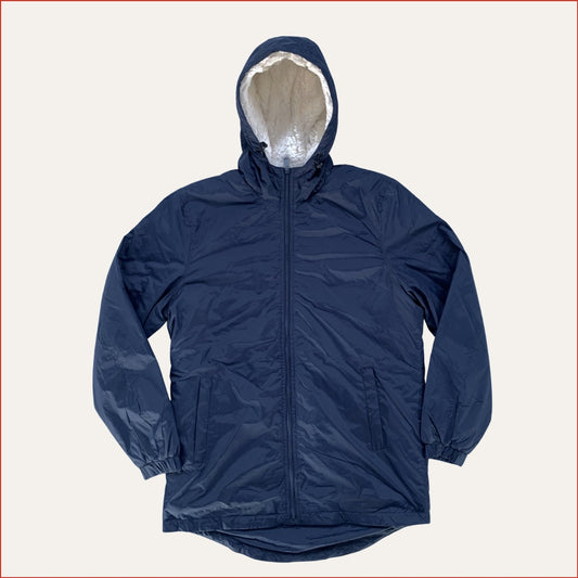 Navy blue Shoreditch and Hale parka with a white fleece inner hood on a white background. Minimalist casual design by Shoreditch and Hale.