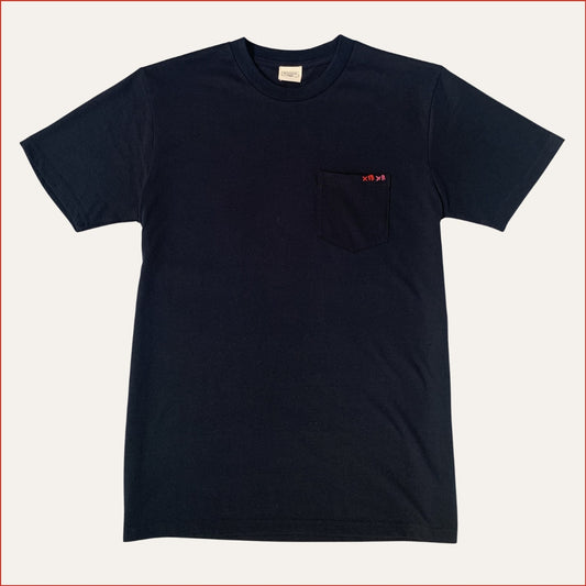 Flat lay image of a men's soft cotton navy pocket tshirt with contrast red stitching on the chest against a white background. Minimalist and understated design by shoreditch and hale.