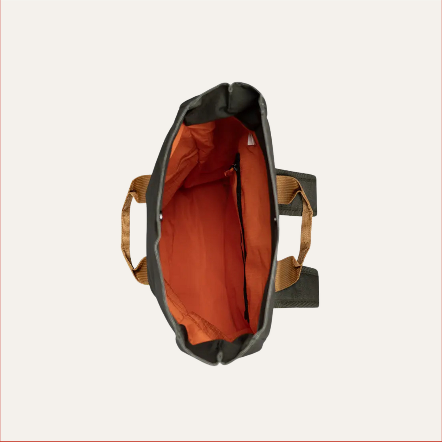 overhead inside view of -tone rolltop backpack with tan base, grey upper, black top flap and orange drawcord with orange inner lining — modern utility bag for men by Shoreditch & Hale.