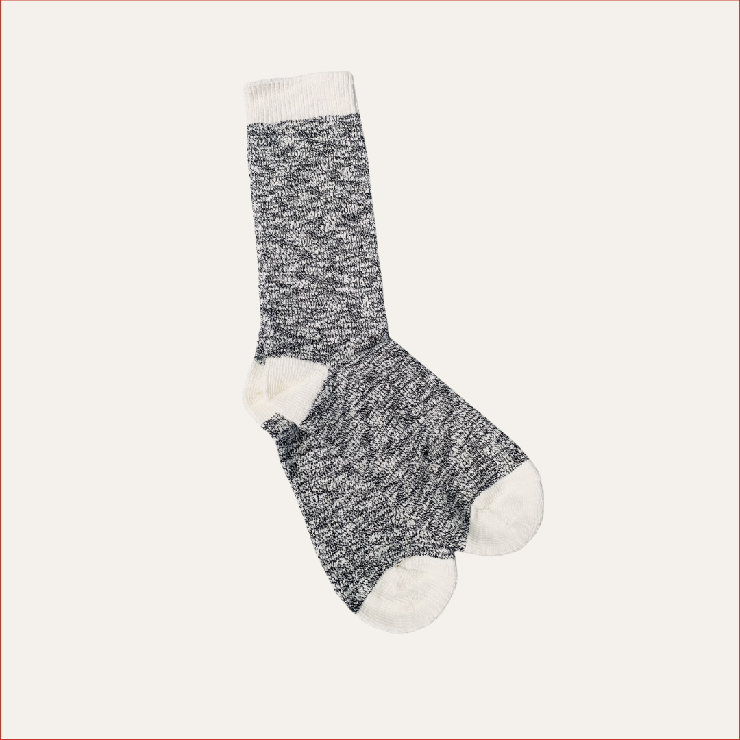 Flat lay Marled gray and white shoreditch and hale sock on a light beige background