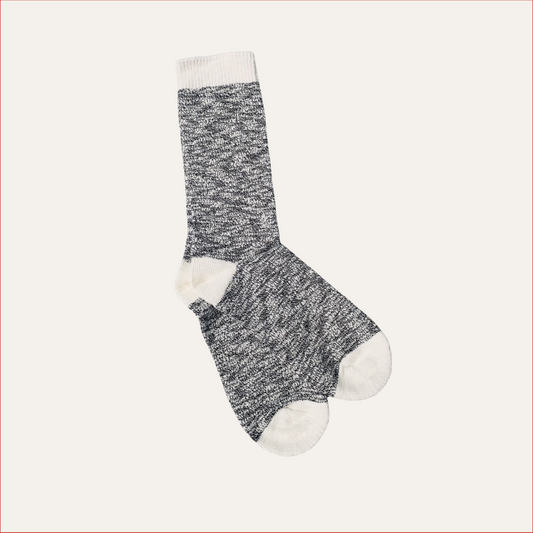 Flat lay Marled gray and white shoreditch and hale sock on a light beige background