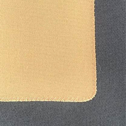 Close up image of a Carbon Blue men's sweatshirt with a brown rectangular patch. Minimalist design casual wear by shoreditch and hale