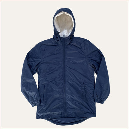 Navy blue Shoreditch and Hale parka with a white fleece inner hood on a white background. Minimalist casual design by  Shoreditch and Hale.