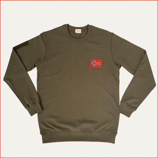 Flay lay image of a shoreditch and hale Green sweatshirt with a small flag patch on a white background. casual menswear